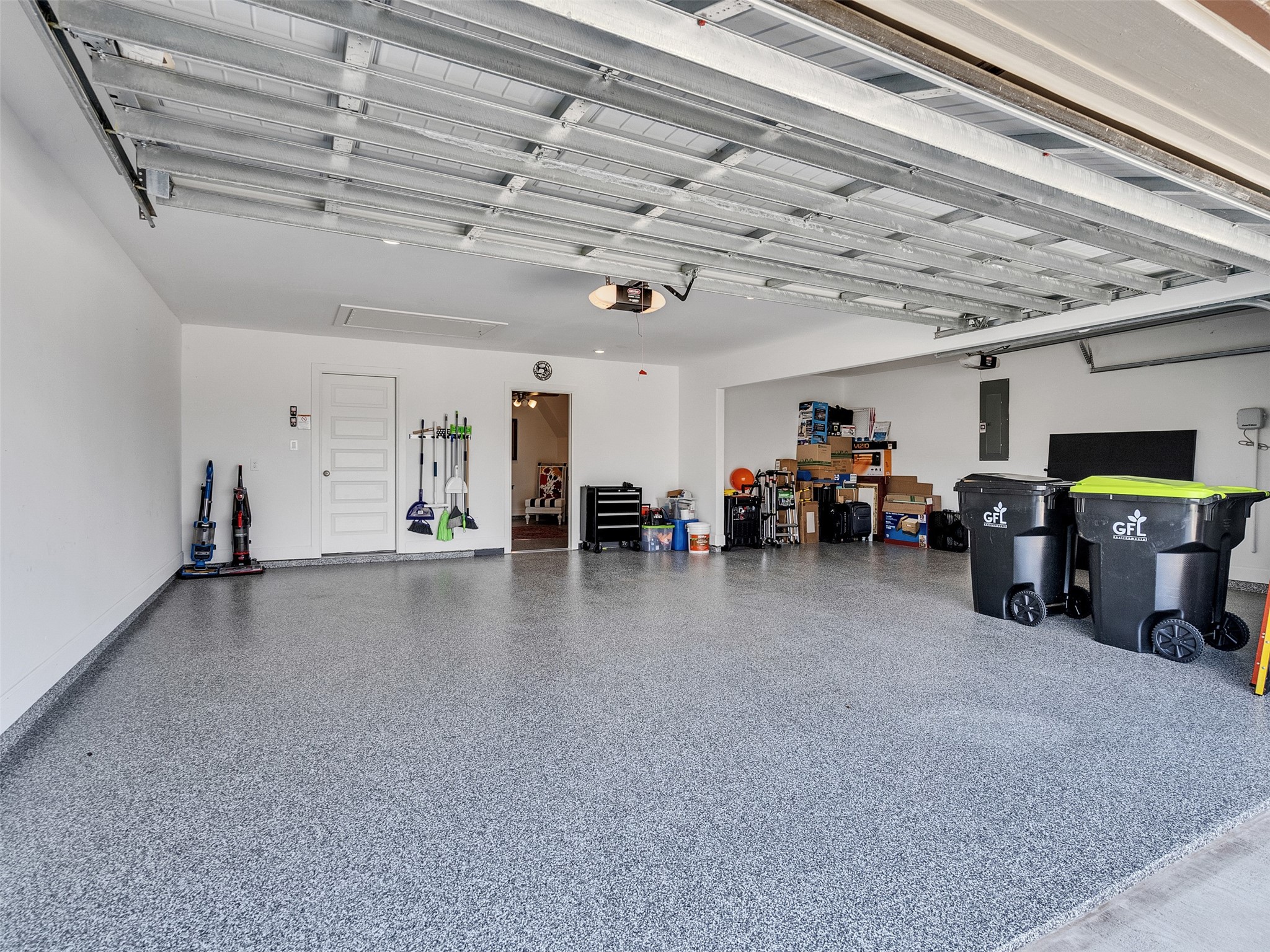 5422 Farm Hill Way Fulshear, TX 77406 - Photo 48 of 50 a living room with lots of furniture and a chandelier