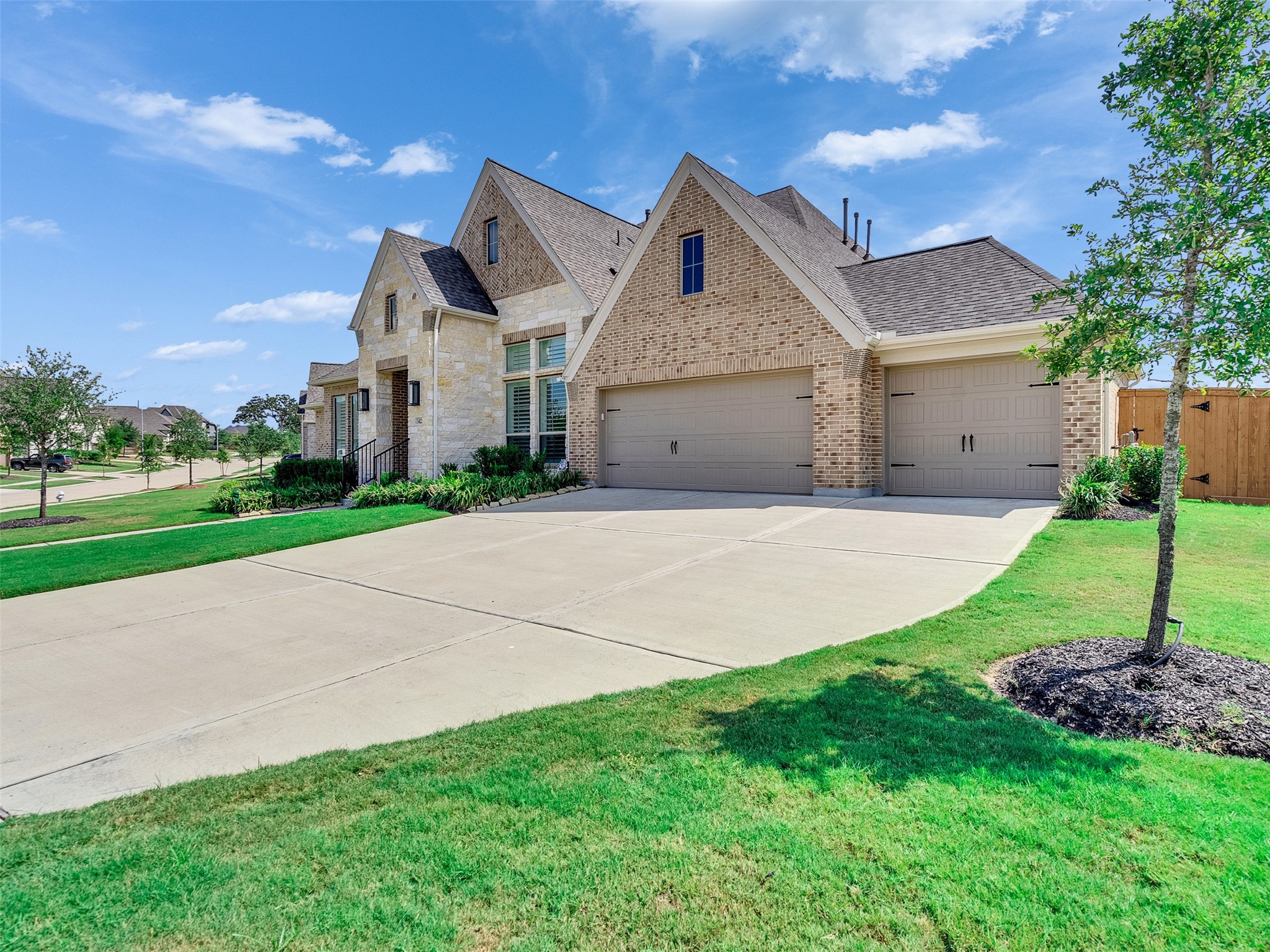 5422 Farm Hill Way Fulshear, TX 77406 - Photo 50 of 50 a front view of a house with a yard and garage