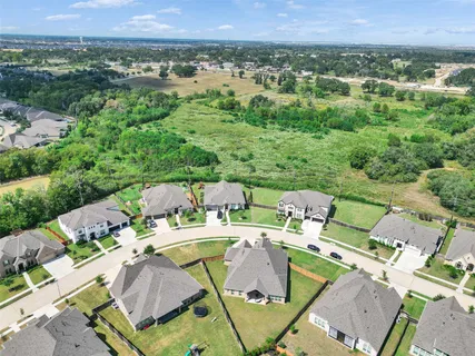 an aerial view of a house with outdoor space