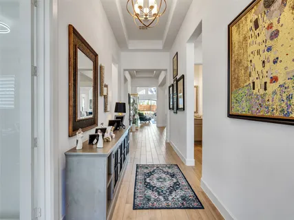 a view of living room with furniture and a rug