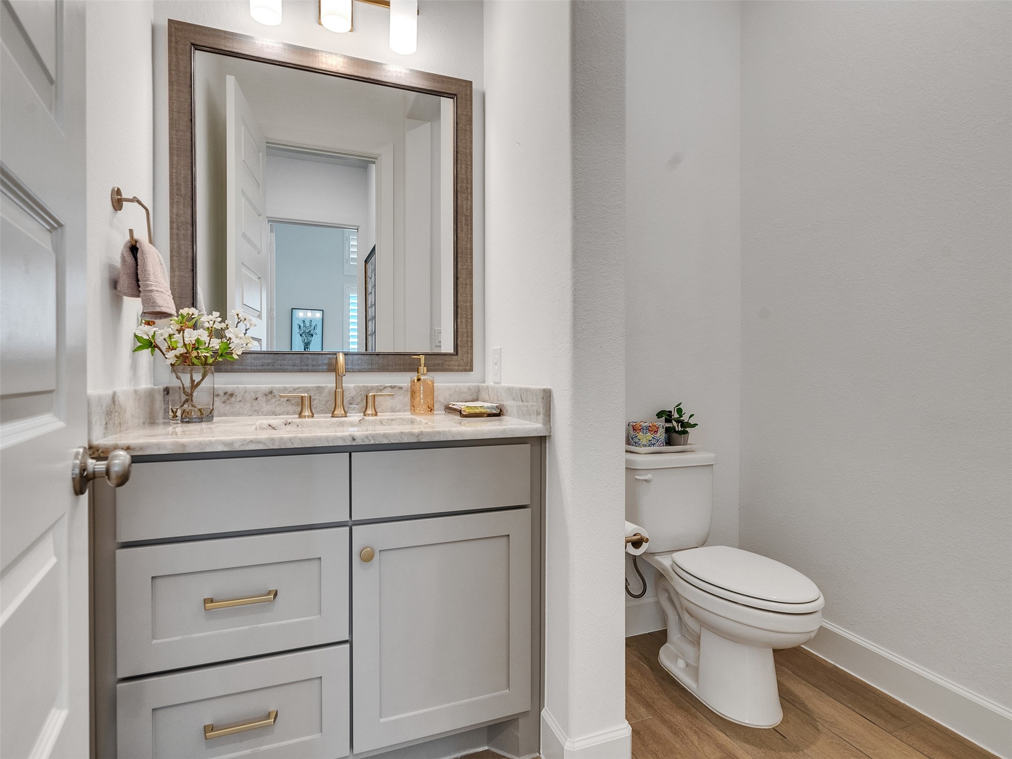 5422 Farm Hill Way Fulshear, TX 77406 - Photo 9 of 50 a bathroom with a toilet a sink and mirror