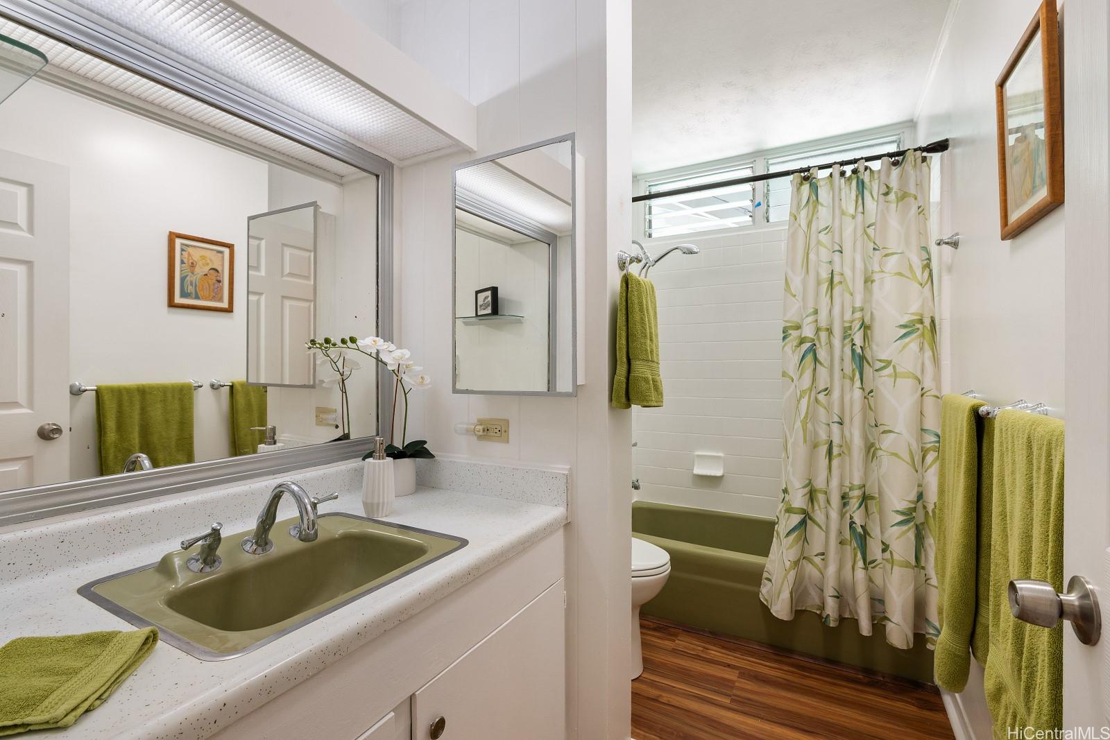 240 Puiwa Road Honolulu, HI 96817 - Photo 11 of 18 a bathroom with a sink and a mirror