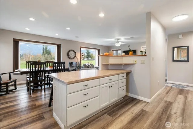 a hall with cabinets and wooden floor