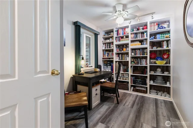 a view of a workspace with furniture and bathroom