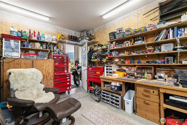 a room with lots of books and a wooden floor