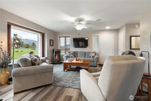 a living room with furniture and a flat screen tv