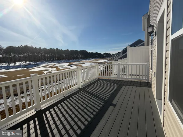 a view of balcony with wooden floor and city view