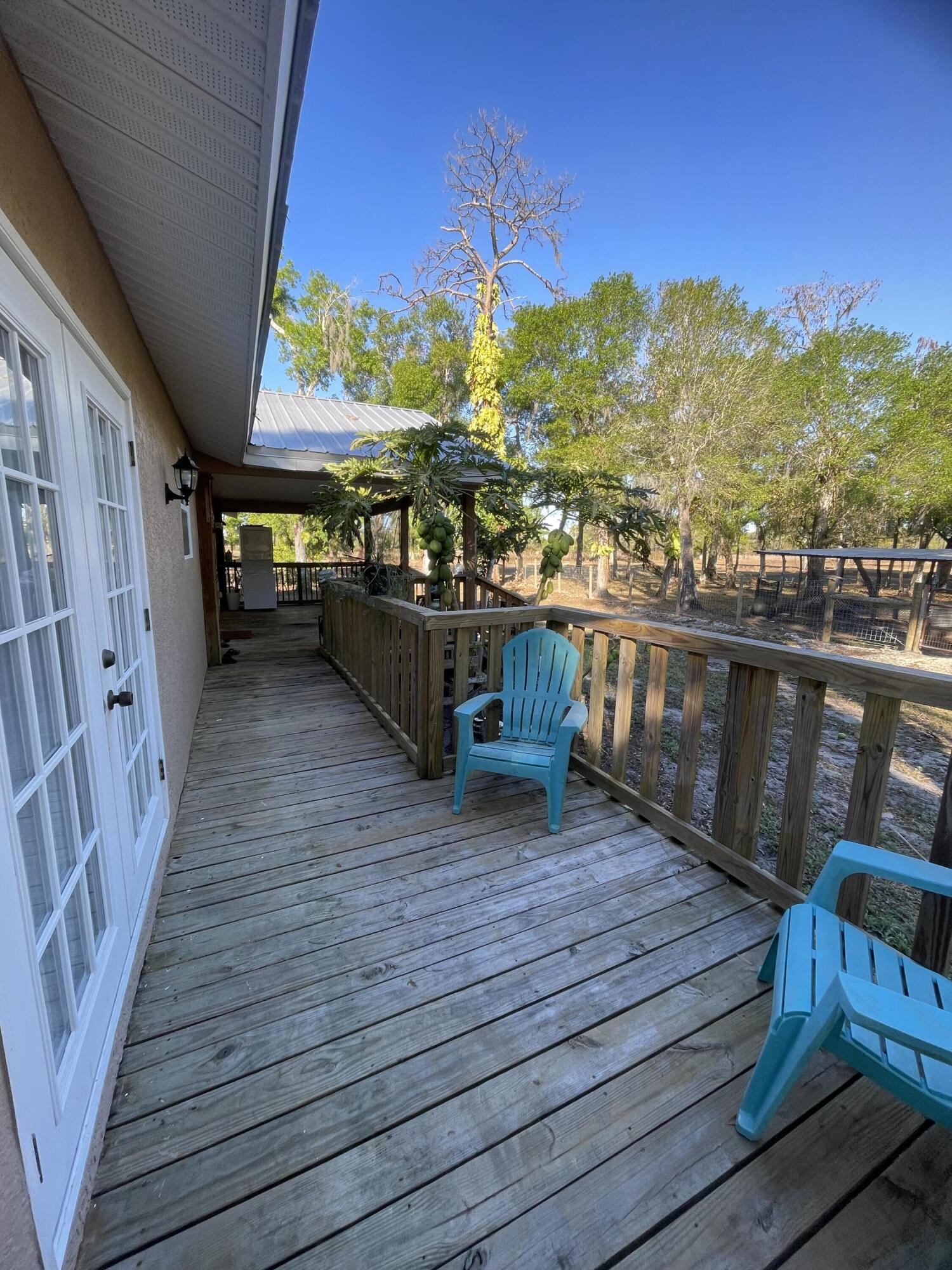 1220 A Road LaBelle, FL 33935 - Photo 13 of 42 a view of a balcony with wooden floor