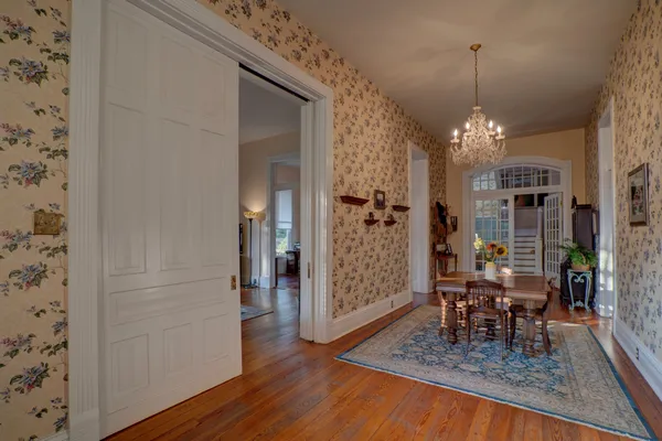 a bedroom with bed and a chandelier