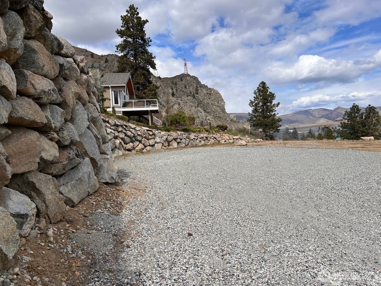 15330 Lakeview Street Entiat, WA 98822 - Photo 15 of 27 a front view of a house with a yard and mountain view in back