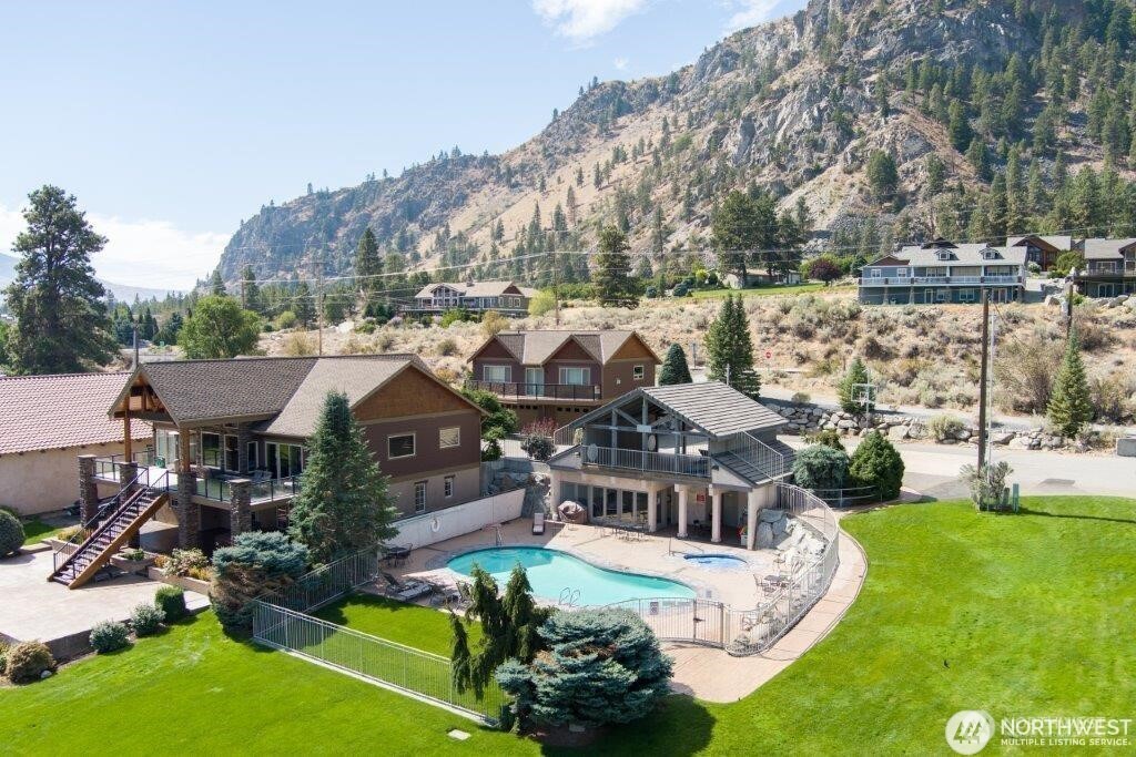 15330 Lakeview Street Entiat, WA 98822 - Photo 20 of 27 a view of a house with a big yard and sitting area