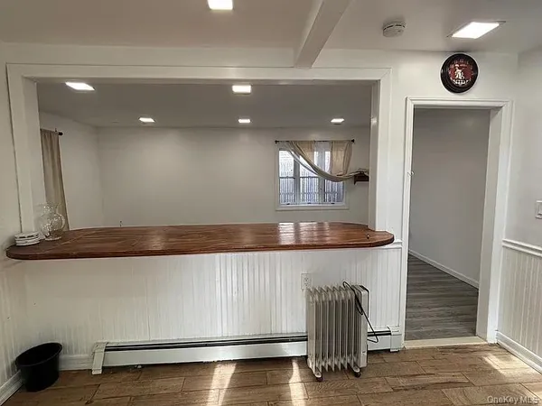a kitchen with granite countertop a table and chair