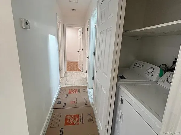 view of hallway with washing machine