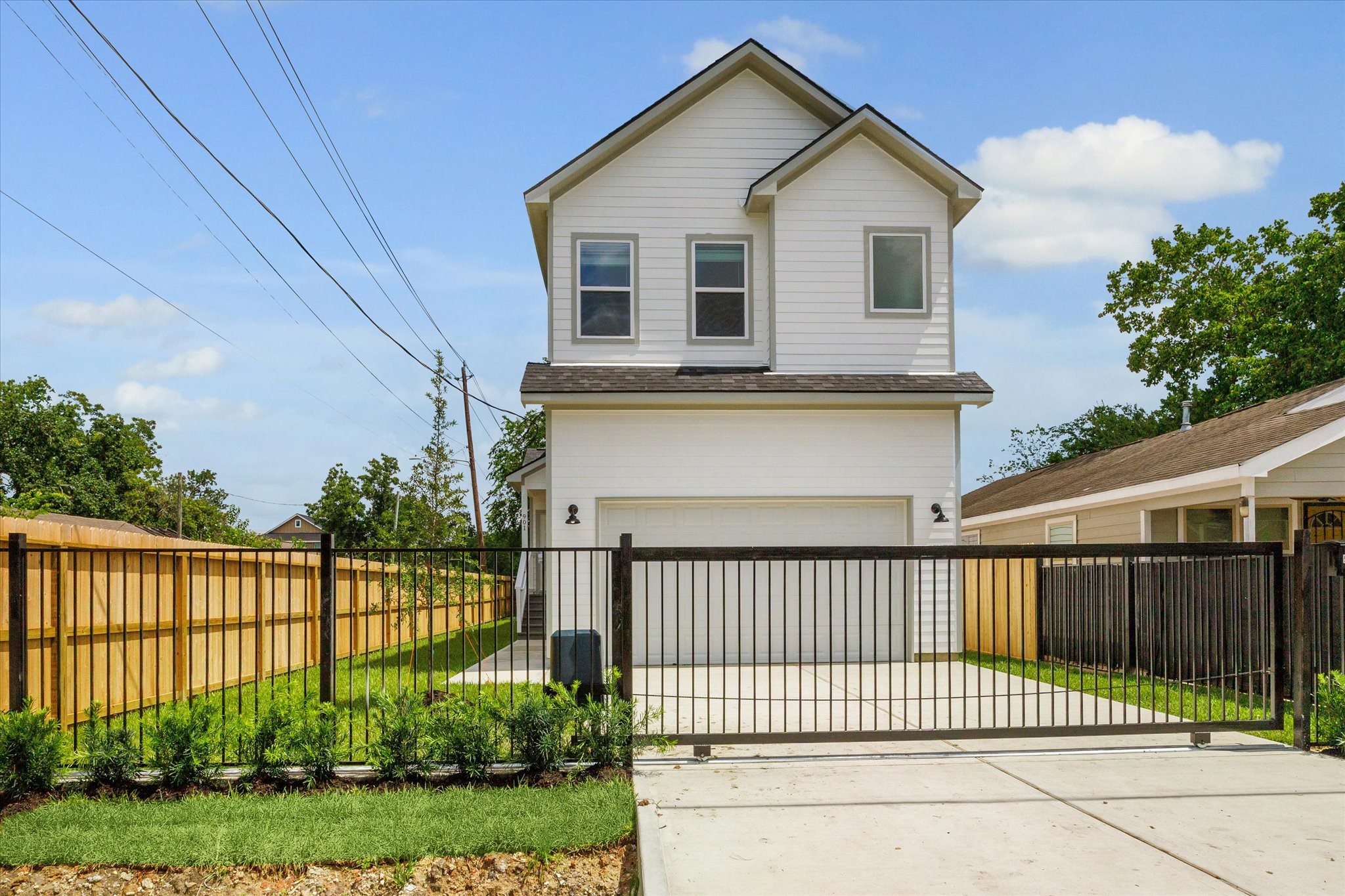901 East 37th Street Houston, TX 77022 - Photo 1 of 19 a view of a white house in front of a yard