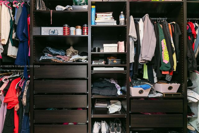 a bathroom with a bathtub sink and mirror