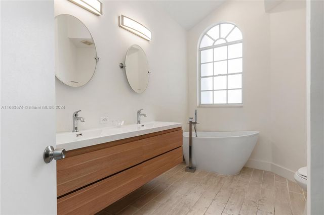 a bathroom with a bathtub sink and toilet
