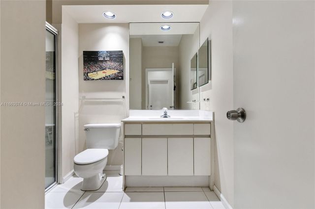 a bedroom with a bed and cabinets