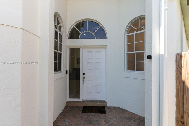 a kitchen with stainless steel appliances granite countertop a sink a stove and a microwave