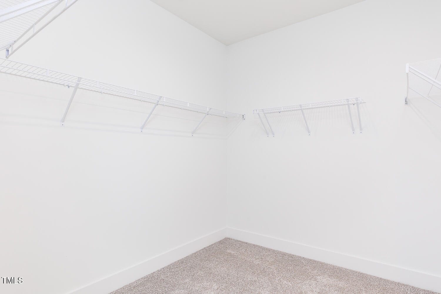 63 Tee Time Terrace Four Oaks, NC 27524 - Photo 20 of 36 a view of a room with racks on the wall