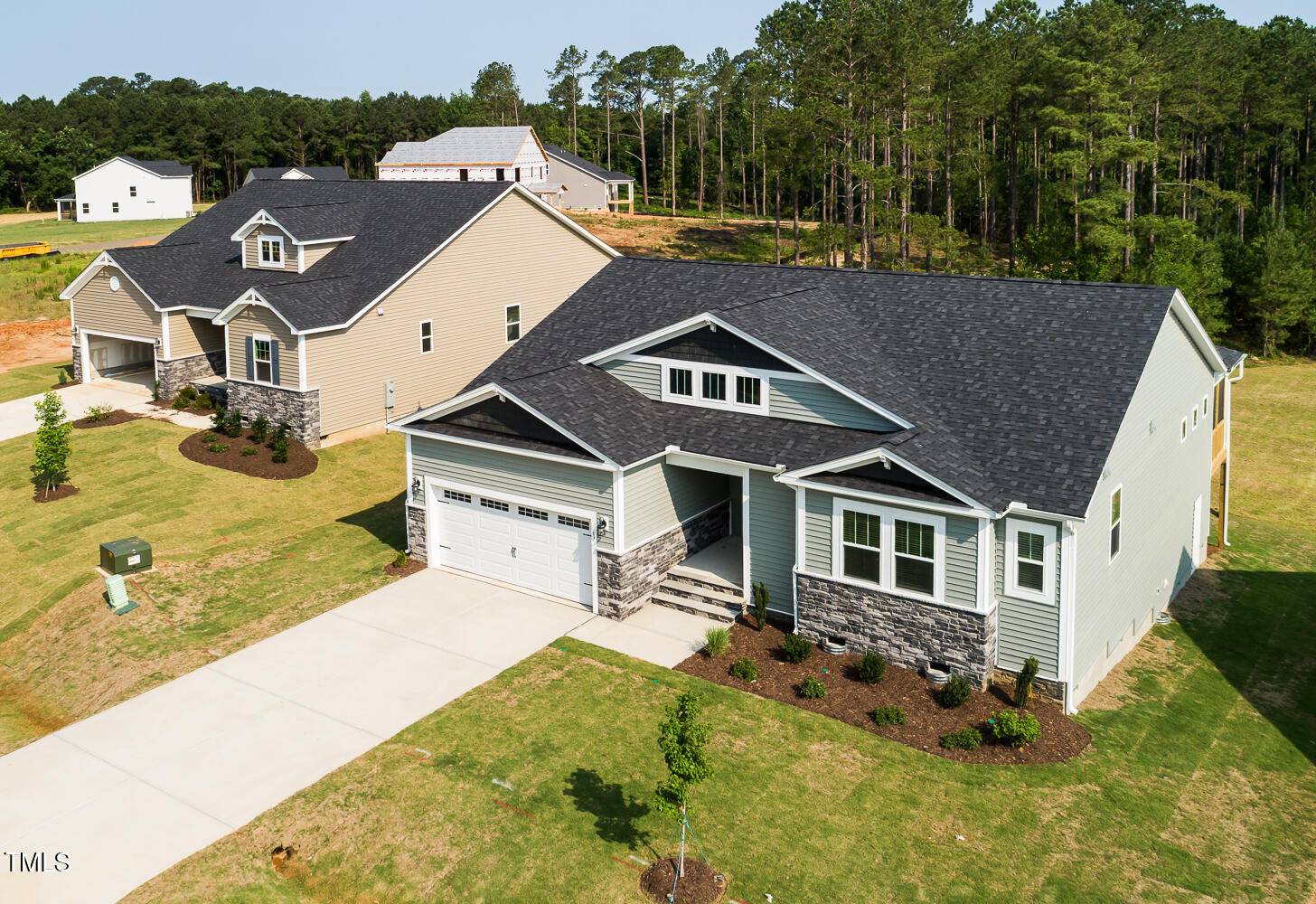 63 Tee Time Terrace Four Oaks, NC 27524 - Photo 2 of 36 an aerial view of a house with swimming pool and big yard