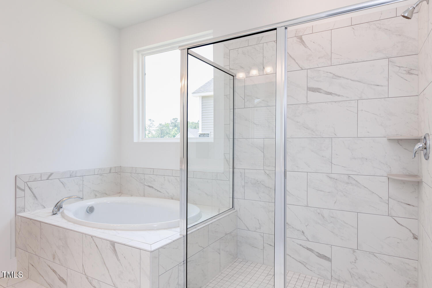 63 Tee Time Terrace Four Oaks, NC 27524 - Photo 21 of 36 a bathroom with a bathtub and shower