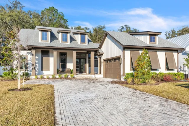 a front view of a house with basket ball court and outdoor seating