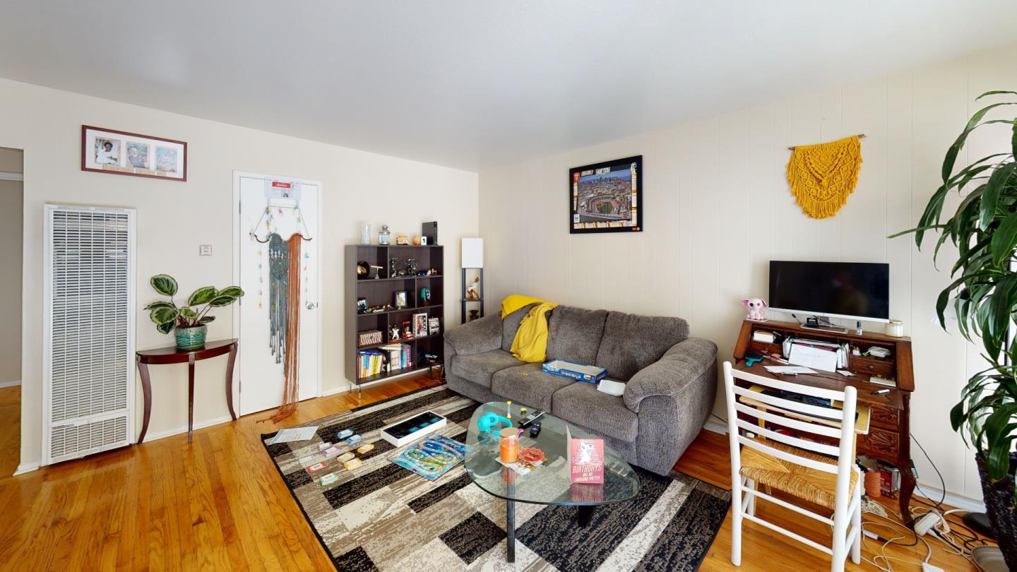 2408 Palmetto Avenue Pacifica, CA 94044 - Photo 19 of 51 a living room with furniture and a flat screen tv