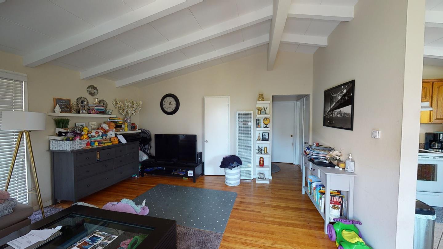 2408 Palmetto Avenue Pacifica, CA 94044 - Photo 22 of 51 a living room with furniture and a flat screen tv