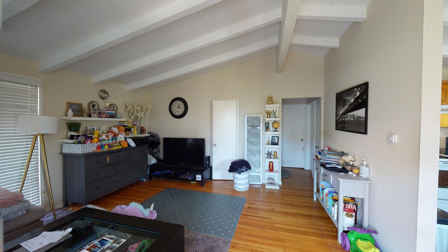 2408 Palmetto Avenue Pacifica, CA 94044 - Photo 23 of 51 a living room with furniture and a flat screen tv
