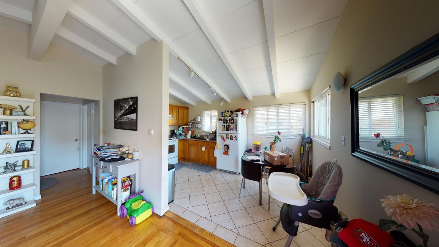 2408 Palmetto Avenue Pacifica, CA 94044 - Photo 24 of 51 a living room with furniture and a wooden floor