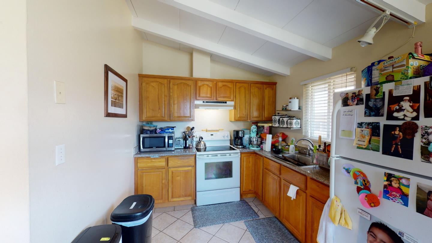 2408 Palmetto Avenue Pacifica, CA 94044 - Photo 25 of 51 a kitchen with lots of clutter and stainless steel appliances