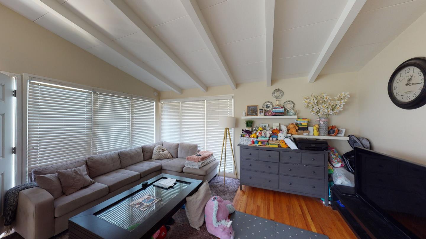 2408 Palmetto Avenue Pacifica, CA 94044 - Photo 27 of 51 a living room with furniture and a window