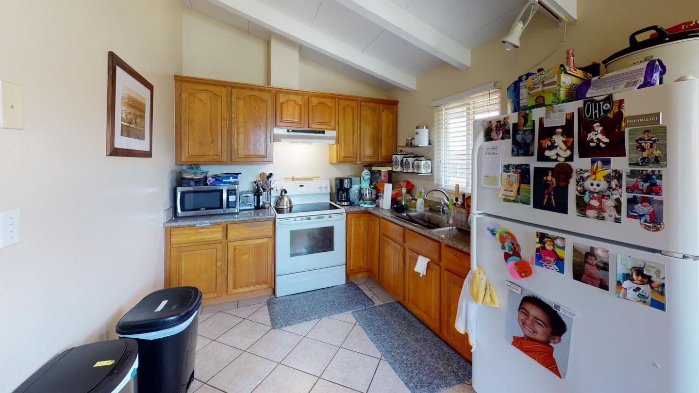 2408 Palmetto Avenue Pacifica, CA 94044 - Photo 33 of 51 a kitchen with stainless steel appliances a sink and a refrigerator