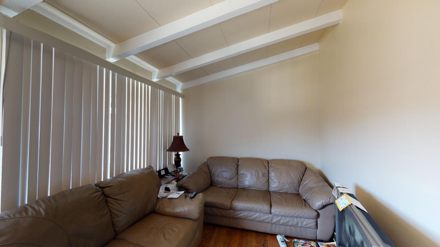 2408 Palmetto Avenue Pacifica, CA 94044 - Photo 35 of 51 a living room with furniture and a window