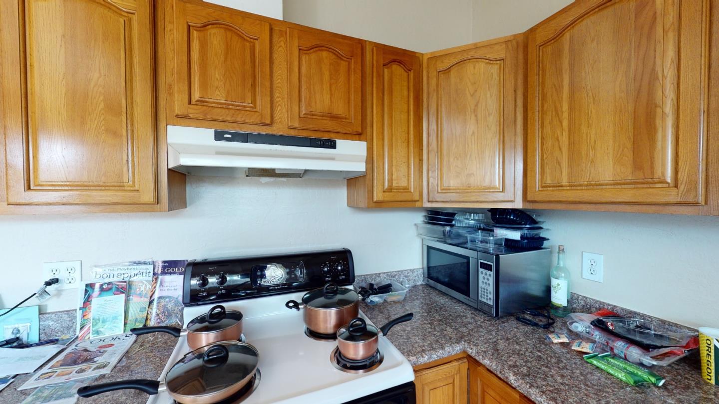2408 Palmetto Avenue Pacifica, CA 94044 - Photo 36 of 51 a kitchen with stainless steel appliances granite countertop a sink dishwasher stove and cabinets
