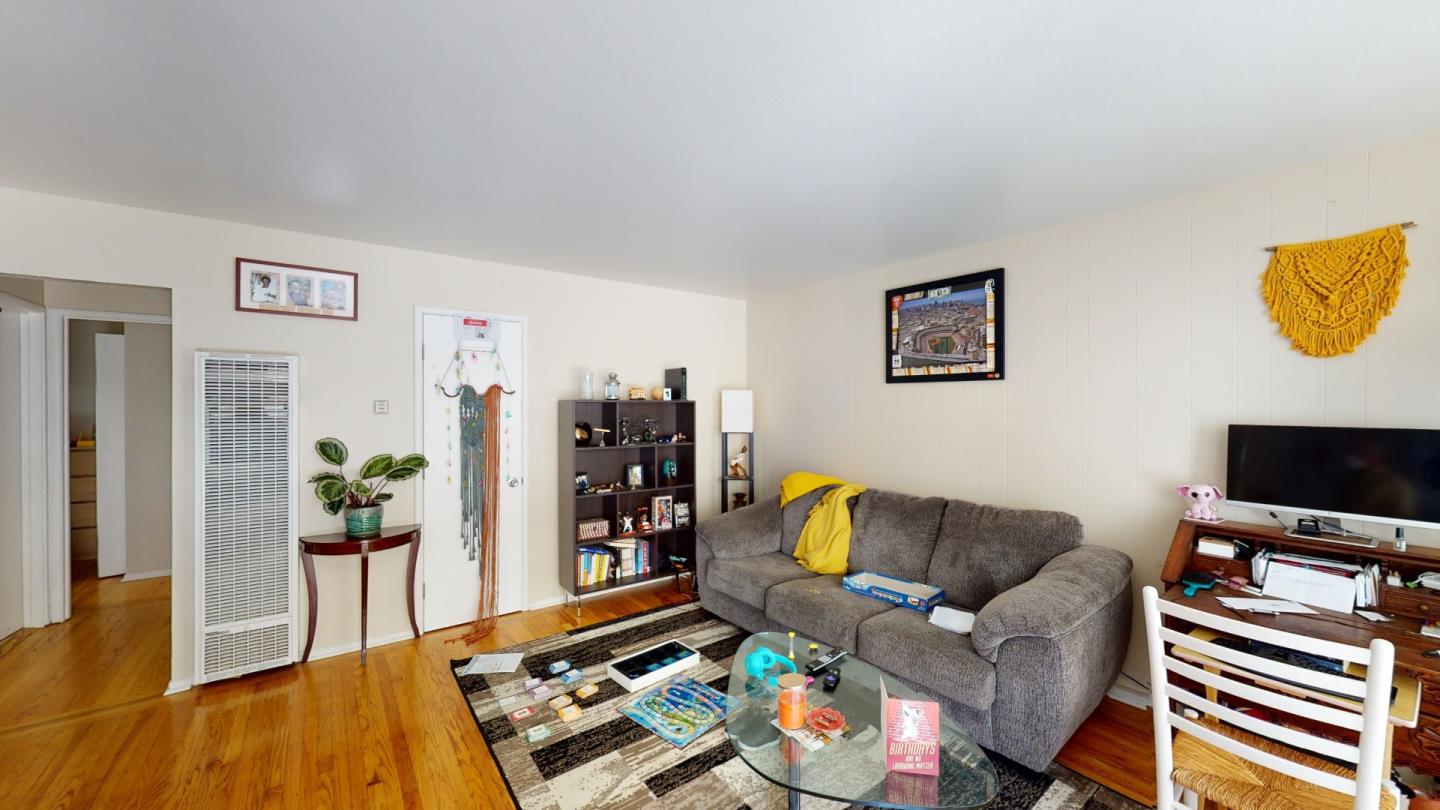 2408 Palmetto Avenue Pacifica, CA 94044 - Photo 4 of 51 a living room with furniture and a flat screen tv