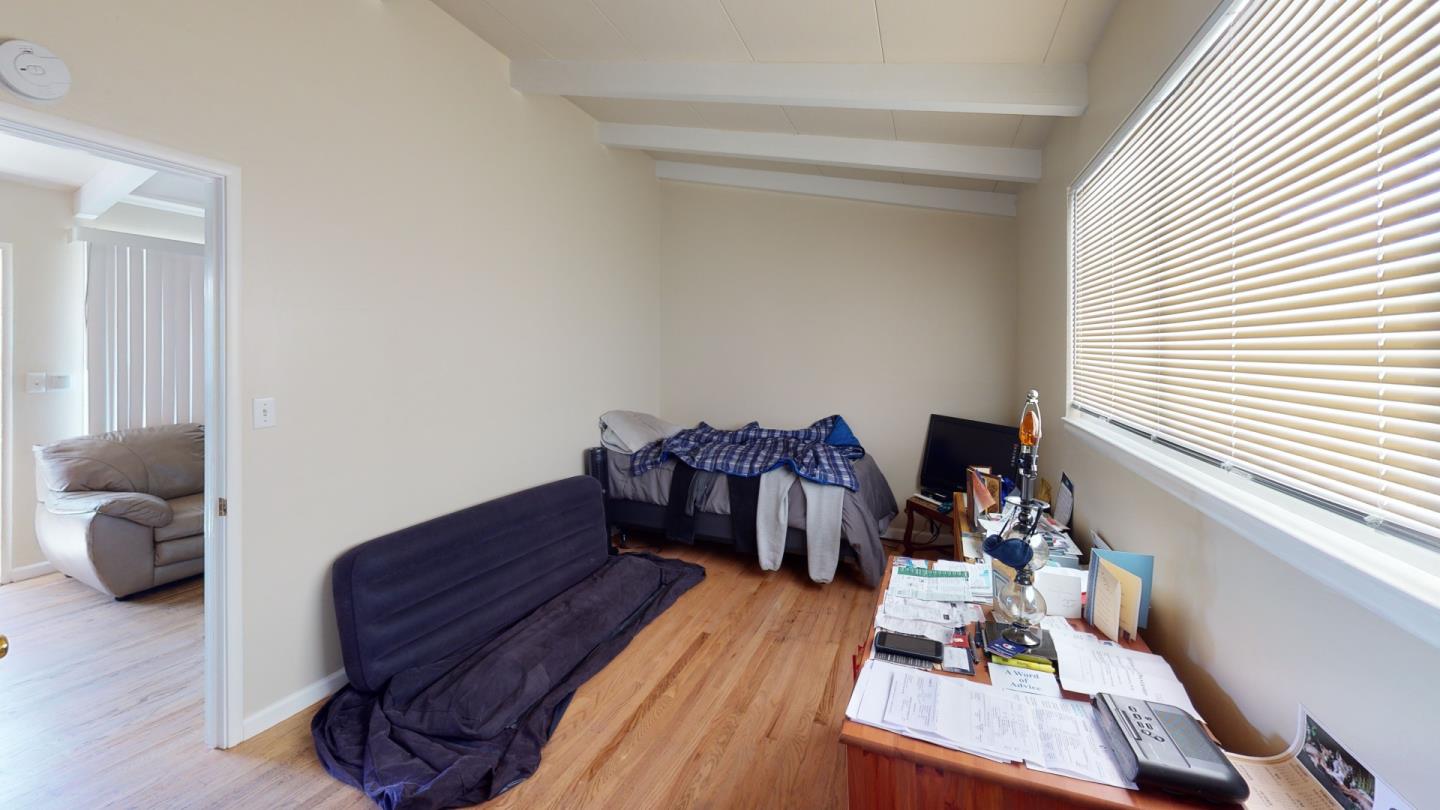 2408 Palmetto Avenue Pacifica, CA 94044 - Photo 44 of 51 a living room with furniture and a wooden floor