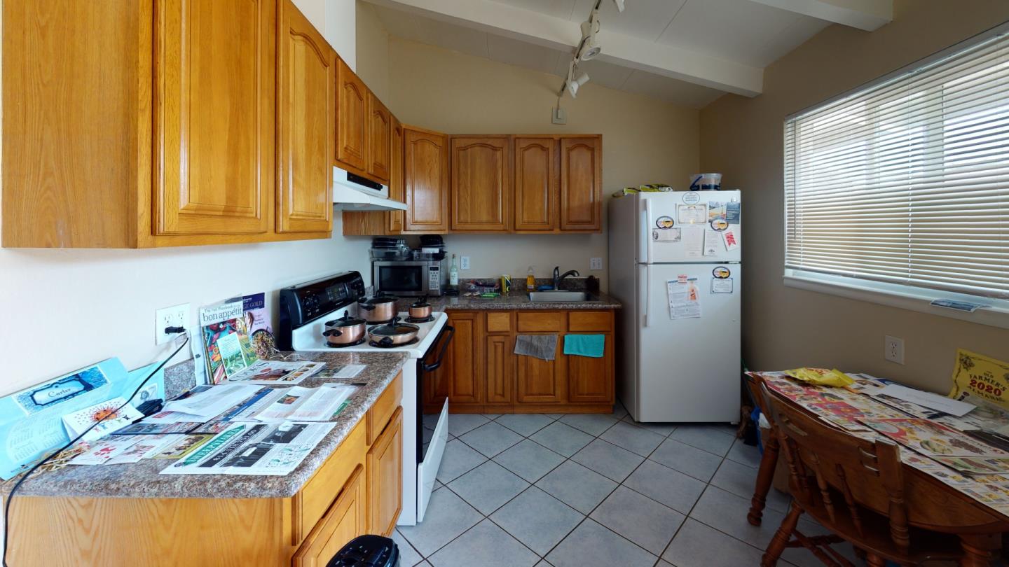 2408 Palmetto Avenue Pacifica, CA 94044 - Photo 47 of 51 a kitchen with a stove a refrigerator and a sink
