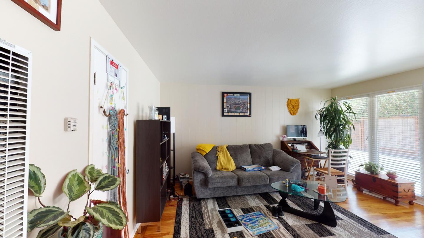 2408 Palmetto Avenue Pacifica, CA 94044 - Photo 8 of 51 a living room with furniture and a potted plant
