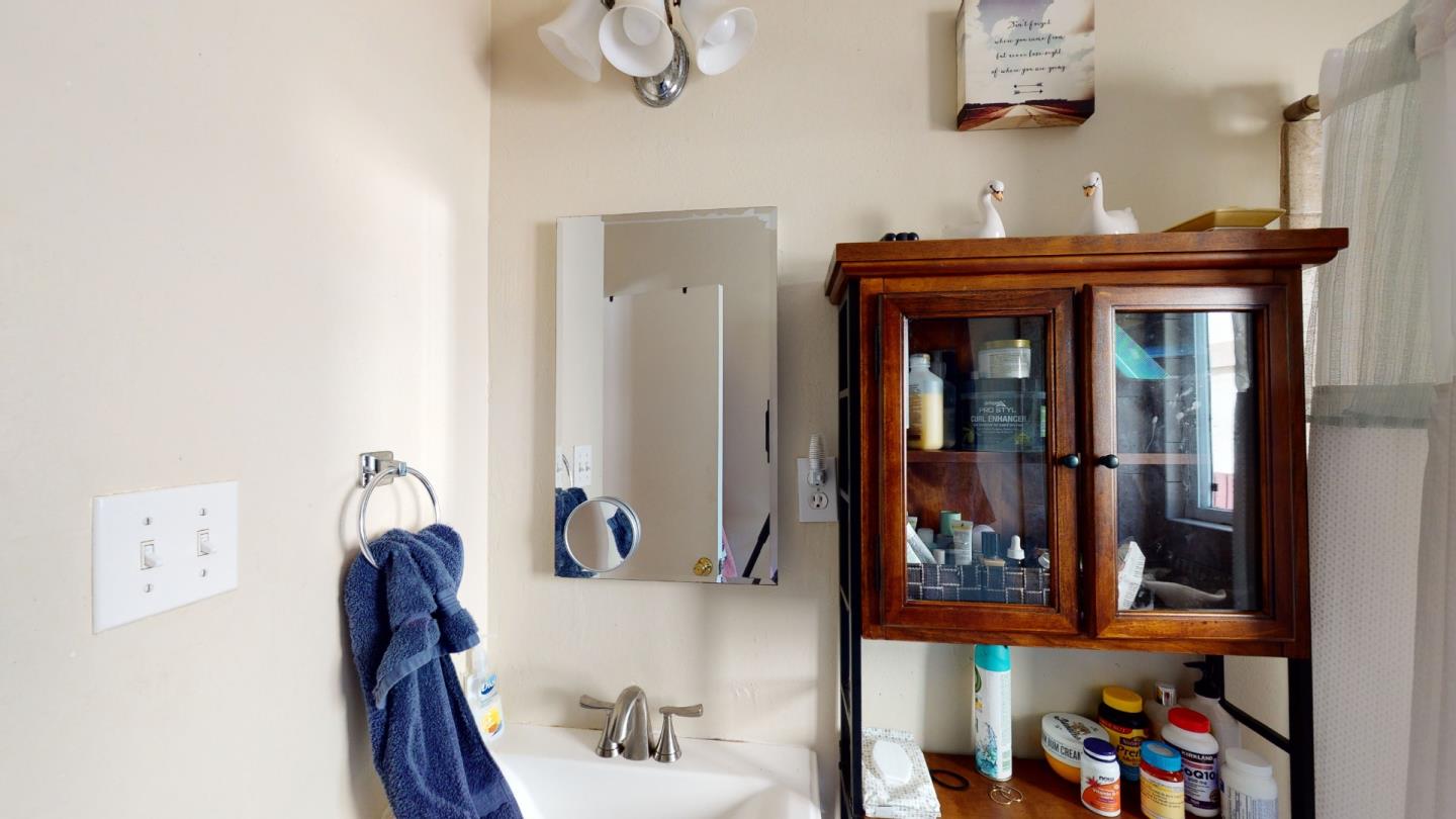 2408 Palmetto Avenue Pacifica, CA 94044 - Photo 10 of 51 a view of a hallway with wooden floor and furniture