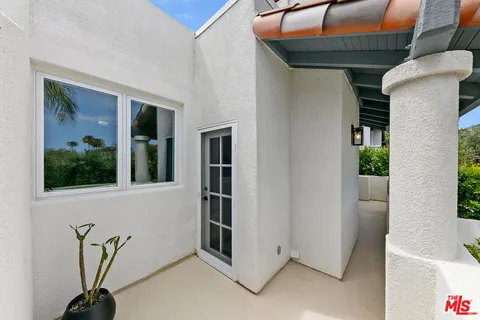 a view of an entryway with a tub
