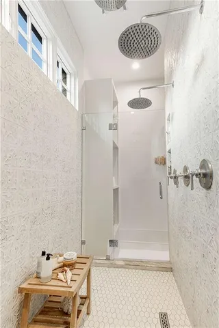 a bathroom with a toilet and shower