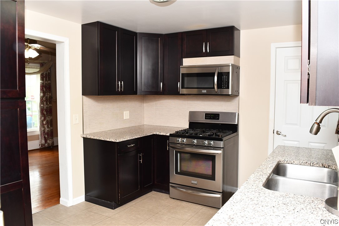6 Triangle Place Lysander, NY 13027 - Photo 19 of 47 The dark kitchen cabinets make this house a little
