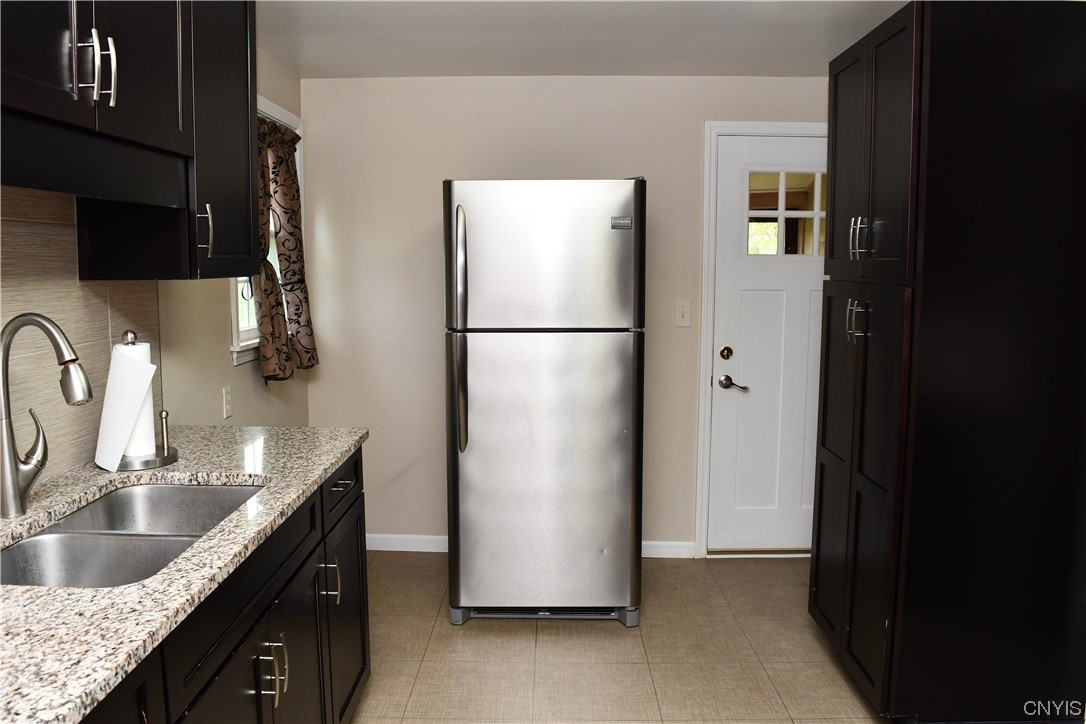 6 Triangle Place Lysander, NY 13027 - Photo 21 of 47 Back door leads to a small back porch which then l