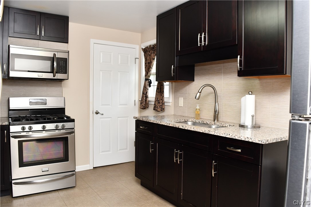 6 Triangle Place Lysander, NY 13027 - Photo 22 of 47 The kitchen door leads you to the basement which h