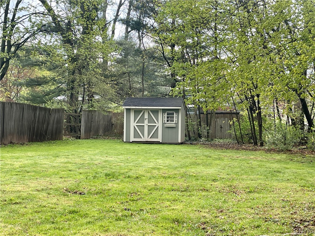 6 Triangle Place Lysander, NY 13027 - Photo 47 of 47 The shed gives room for more lawn storage and yard