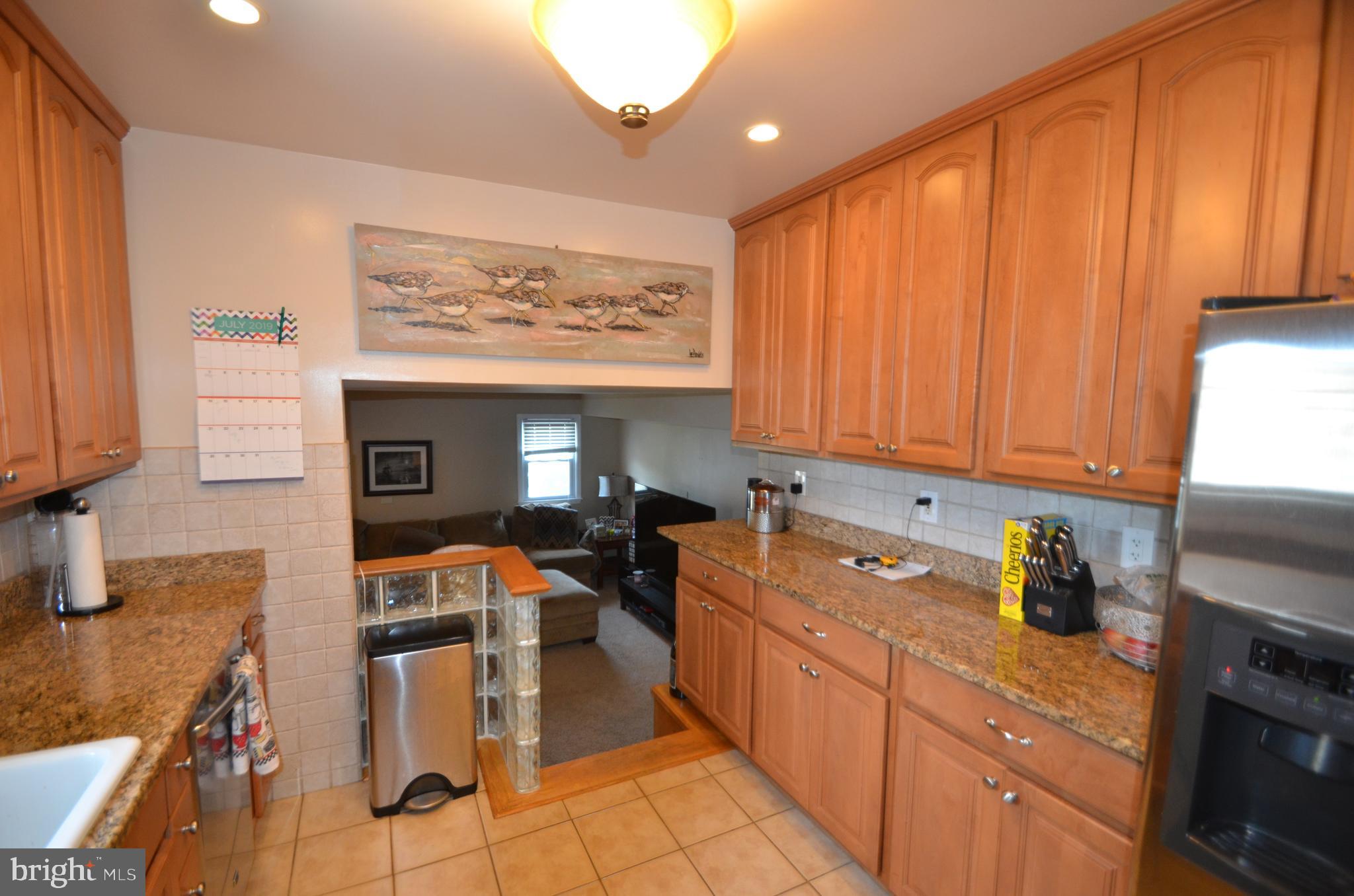 422 Madingley Road Linthicum Heights, MD 21090 - Photo 13 of 36 a kitchen with stainless steel appliances a stove top oven