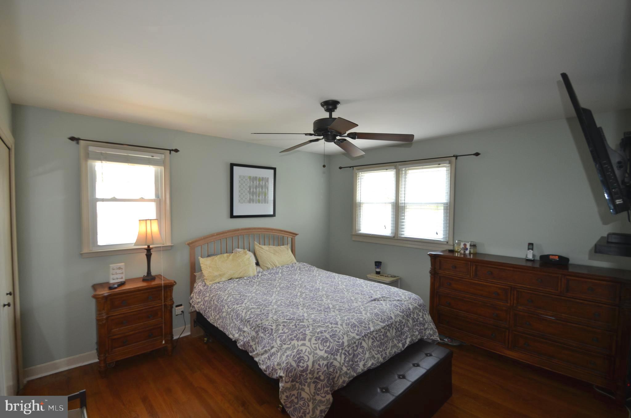 422 Madingley Road Linthicum Heights, MD 21090 - Photo 23 of 36 a bedroom with a bed and a dresser next to a window