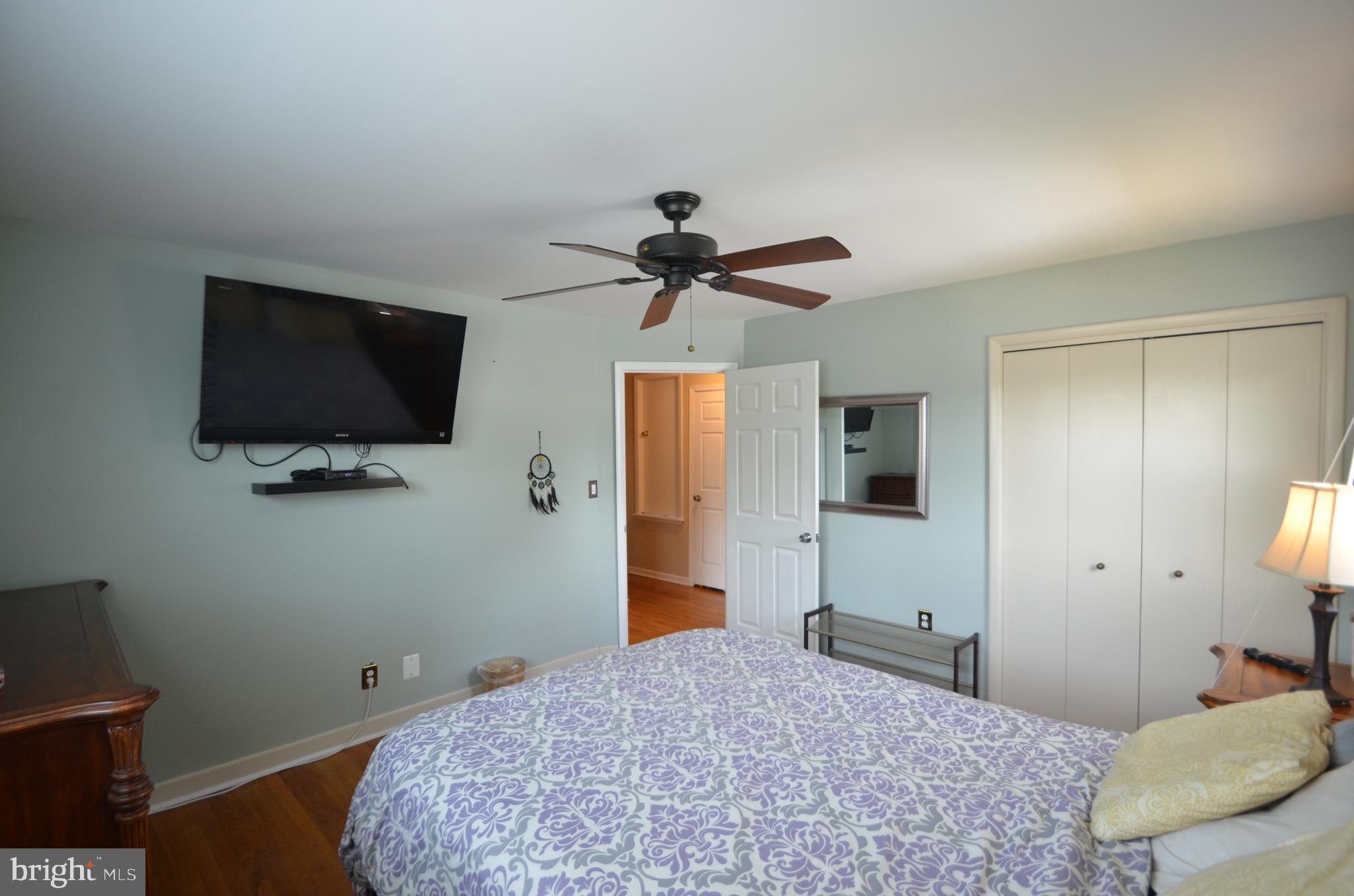 422 Madingley Road Linthicum Heights, MD 21090 - Photo 25 of 36 a bedroom with a bed and a flat screen tv