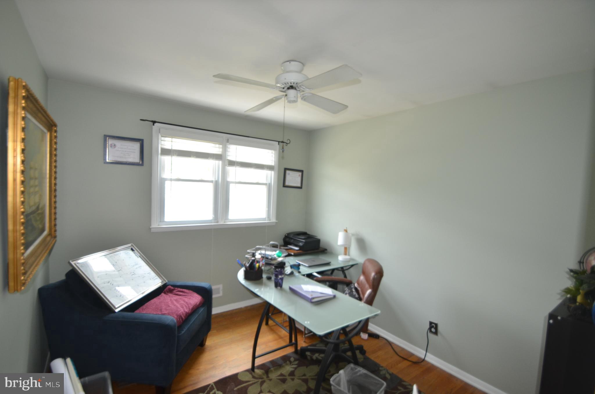 422 Madingley Road Linthicum Heights, MD 21090 - Photo 30 of 36 a view of a workspace with furniture and a window